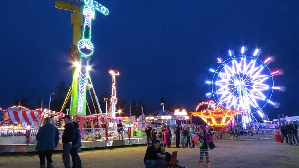 Illuminated rides and visitors at the Alaska State Fair midway in Palmer in 2015