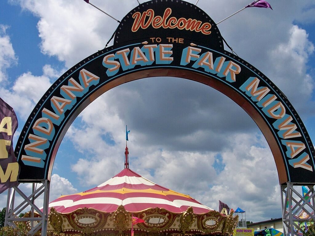 Indiana State Fair Midway entrance arch above a carousel in 2008